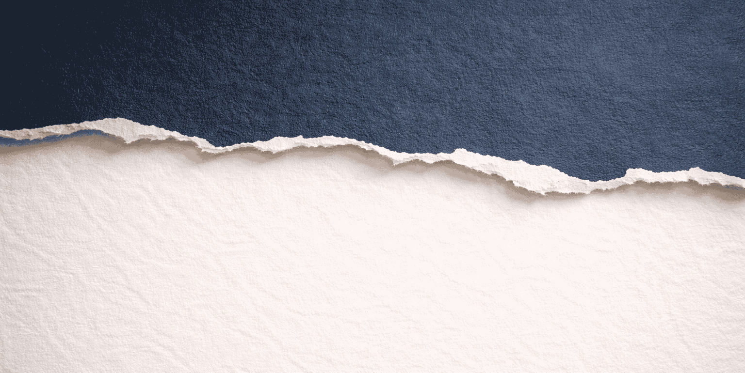 Torn navy paper revealing white space